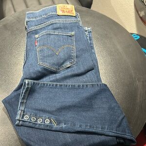 Great condition with snaps on the legs no holes or tears super fun Levi’s